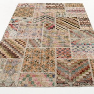 May include: A patchwork rug with a variety of colors and patterns, including brown, beige, red, green, and blue. The rug is made of different pieces of fabric that have been sewn together.