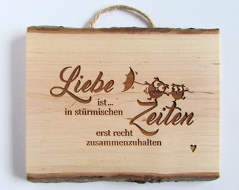 Saying sign wood, love is.... to hold together even more in stormy times. engraving plate