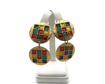 May include: Gold tone earrings with two round, multi-colored, enamel squares. The squares are red, green, and yellow.