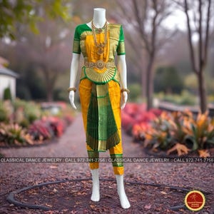 May include: A traditional Indian classical dance costume on a mannequin. The outfit features a yellow top and pants with green and gold accents. A gold necklace and belt complete the ensemble. The text "CLASSICAL DANCE JEWELRY" is visible at the bottom.