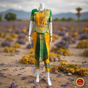 May include: A traditional Indian classical dance costume on a mannequin. The outfit features a yellow skirt and top with green and gold accents. A gold necklace and belt complete the ensemble. The text "CLASSICAL DANCE JEWELRY" is visible.
