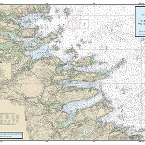 May include: A detailed nautical chart of the Maine coast, depicting Tibbett Narrows to Schoodic Island. The map features landmasses in shades of green and brown, with blue representing the water. Text includes the chart's title and scale.