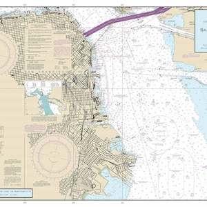 May include: A detailed nautical chart of San Francisco Bay, California, showing Candlestick Point to Angel Island. The chart includes depth soundings, navigational aids, and the scale is 1:20,000. The map is in shades of blue, tan, and white.