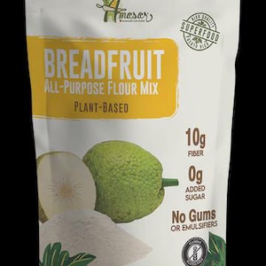 May include: A bag of breadfruit all-purpose flour mix. The bag is white with green and yellow accents. The text on the bag reads "Breadfruit All-Purpose Flour Mix Plant-Based". The bag also shows a breadfruit and flour.