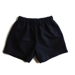 May include: Black athletic shorts with an elastic waistband.