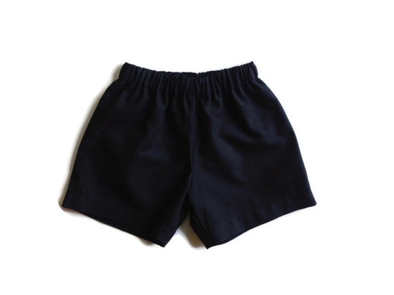 May include: Black athletic shorts with an elastic waistband.