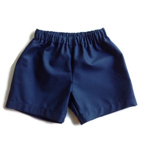 May include: A pair of navy blue shorts with an elastic waistband.