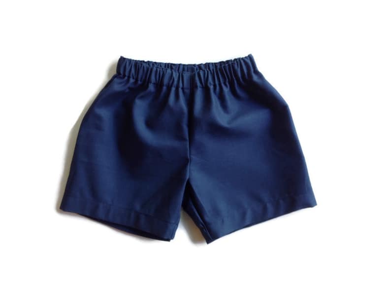 May include: A pair of navy blue shorts with an elastic waistband.