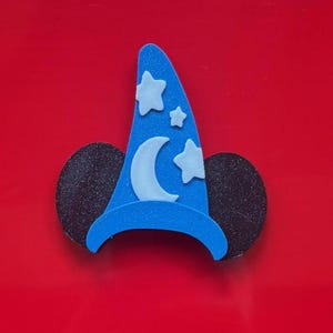 May include: A white ceramic mug with a black handle and the text "But First, Coffee" in a handwritten style. The mug is on a white surface. The mug is approximately 4 inches tall.