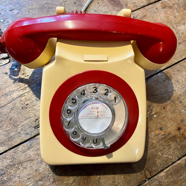 Two-tone cream and red 1960’s rotary telephone. Working order