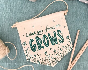 Canvas Banner with Quote - "What you Focus on, Grows"