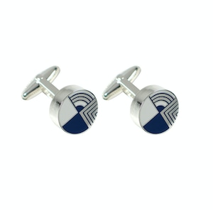 May include: A pair of silver cufflinks with a geometric design. Each cufflink features a circular face with a white, navy blue, and silver pattern. The design includes curved and angular lines, creating a modern aesthetic. The cufflinks have a classic T-bar closure.