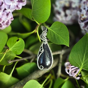 Sterling silver wire wrapped blue goldstone pendant