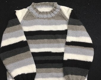 Child’s sweater/jumper. Age 6. Black, white and grey.