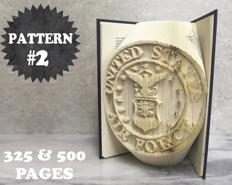 May include: A book with a 3D pop-up design of the United States Air Force emblem. The book is open to reveal the pop-up design, which is made of folded paper. The book is titled "PATTERN #2 325 & 500 PAGES".