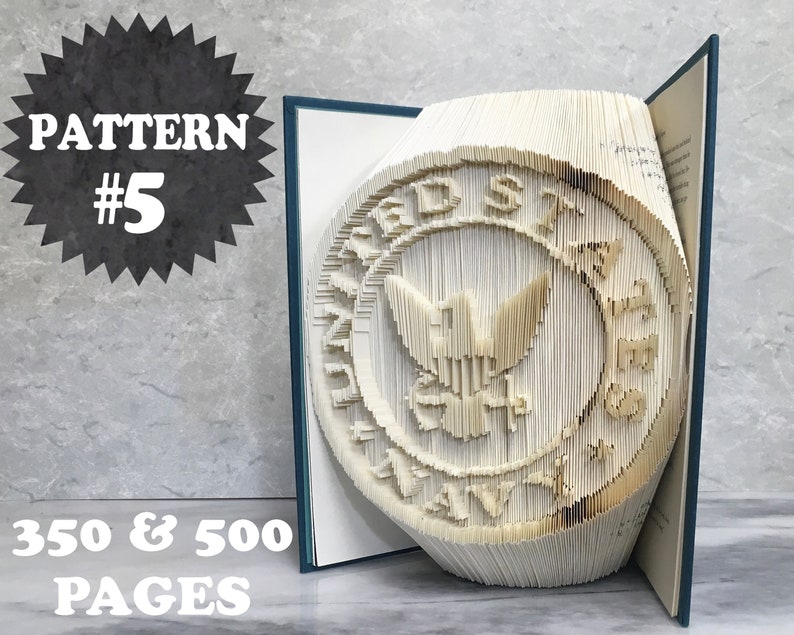 May include: A book with a 3D pop-up design of the United States Navy seal. The book is open and the seal is standing up. The book is made of white paper and has a blue cover. The text "PATTERN #5" and "350 & 500 PAGES" is visible on the image.