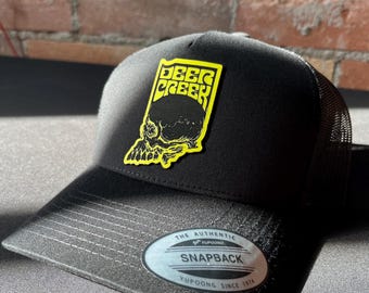 Deer Creek Snap Back/ Black Trucker hat with  yellow logo