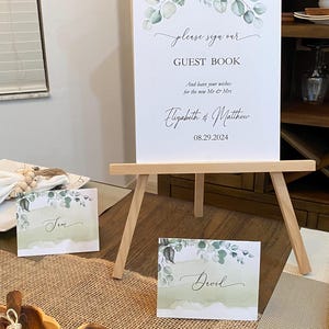 Cartão de lugar de casamento rústico com folhagens de eucalipto e estilo boho. Cartão de lugar de casamento plano e personalizado com folhagens. Cartões de lugar de casamento elegantes, planos e com folhagens.