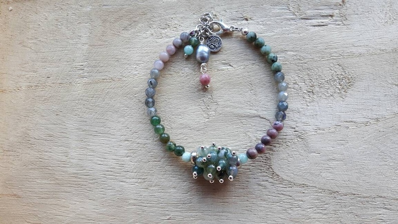 Bracelet of different kinds of semi precious stone and a freshwater pearl