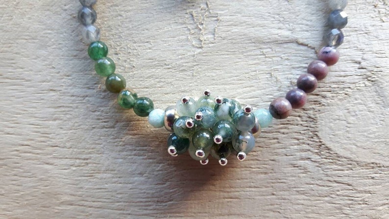 Bracelet of different kinds of semi precious stone and a freshwater pearl