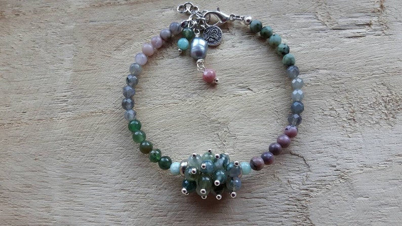 Bracelet of different kinds of semi precious stone and a freshwater pearl
