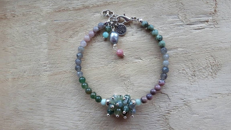 Bracelet of different kinds of semi precious stone and a freshwater pearl