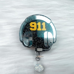 Badgehaspel 911 verzender: dunne gouden lijn, verwisselbare acryltopper