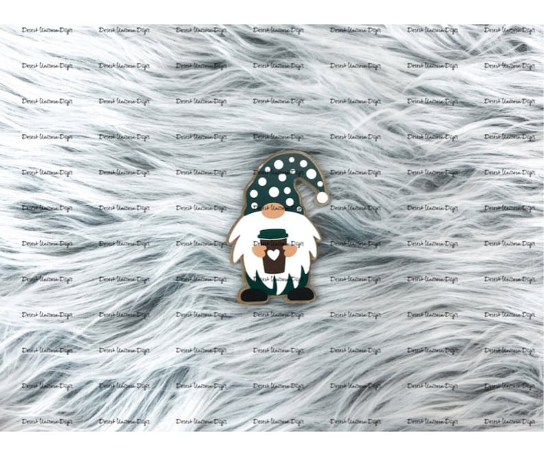 May include: A green and white gnome holding a coffee cup with a heart on it. The gnome has a white beard and a white hat with black polka dots.