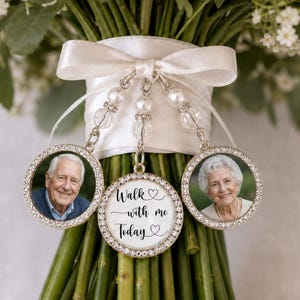 May include: A wedding bouquet charm set featuring three circular pendants with rhinestone borders. Two pendants contain photographs of individuals, while the center pendant displays the black text Walk with me Today with heart icons.