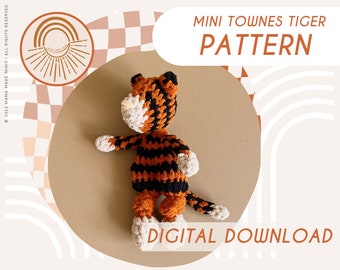 May include: A crochet tiger amigurumi pattern, with a digital download option. The pattern features a black and orange striped tiger with white accents. The image shows the finished product, a crocheted tiger toy.