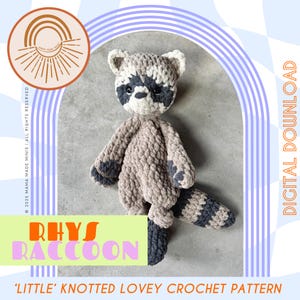 May include: A crocheted raccoon toy in shades of gray and beige, with a striped tail and dark gray accents. The text "Rhys Raccoon" and "Little Knotted Lovey Crochet Pattern" are visible. The image also includes the text "Digital Download".