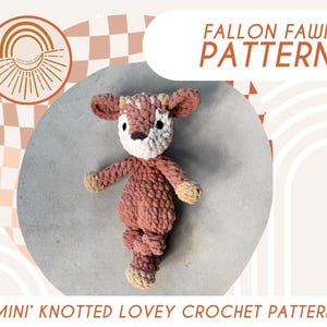 May include: A crochet pattern for a fawn-shaped knotted lovey. The pattern is called "Fallon Fawn" and is available as a digital download. The image shows a crocheted fawn toy in shades of brown and beige.