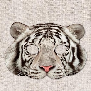Op de afbeelding: Witte tijgergezichtsmasker met zwarte strepen. Het masker heeft ooggaten en een neusgat.