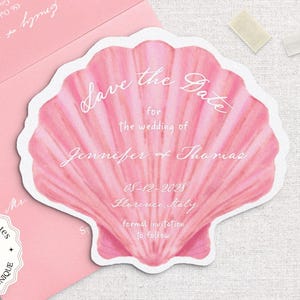 May include: A pink seashell-shaped save-the-date card with white text, featuring the names Jennifer & Thomas and the date 05-12-2028. The card is accompanied by a pink envelope. The text "SHELL SAVE THE DATE TEMPLATE" is at the top.
