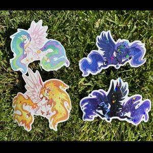 May include: Four colorful vinyl stickers featuring characters from the animated series My Little Pony: Friendship is Magic. The stickers feature Twilight Sparkle, Celestia, Luna, and  Starlight Glimmer. Each sticker has a holographic finish and glitter accents.