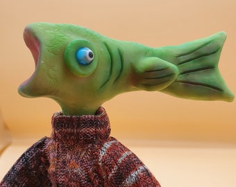 Fish Face is a handmade posable Artdoll has a unique personality sculpted from polymer clay with a wire armature. He is a collectable.