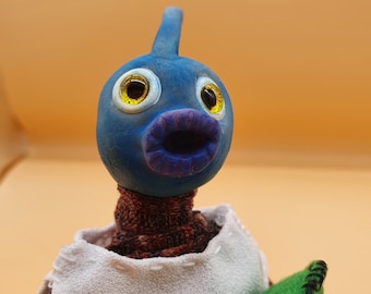 Shark boy is a handmade posable Artdoll has a unique personality sculpted from polymer clay with a wire armature. He is a collectable.