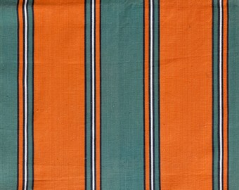May include: Orange and teal striped fabric with a woven texture.