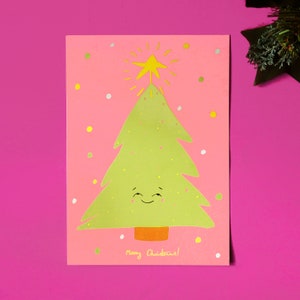 Cheerful Christmas card, printed on eco friendly paper. Cute kawaii illustrated Christmas tree