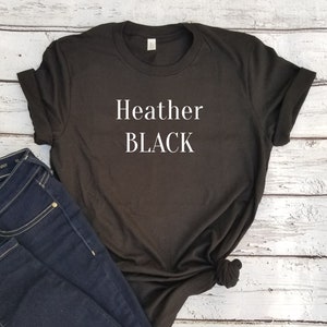 May include: A black t-shirt with the text "Heather BLACK" printed in white on the front.