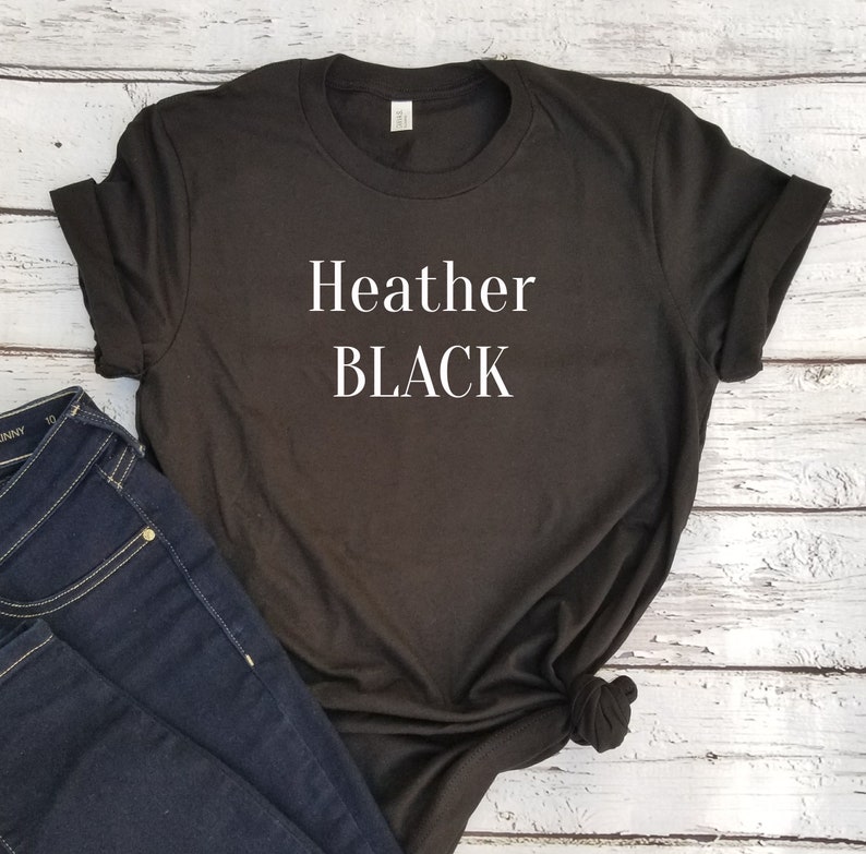 May include: A black t-shirt with the text "Heather BLACK" printed in white on the front.