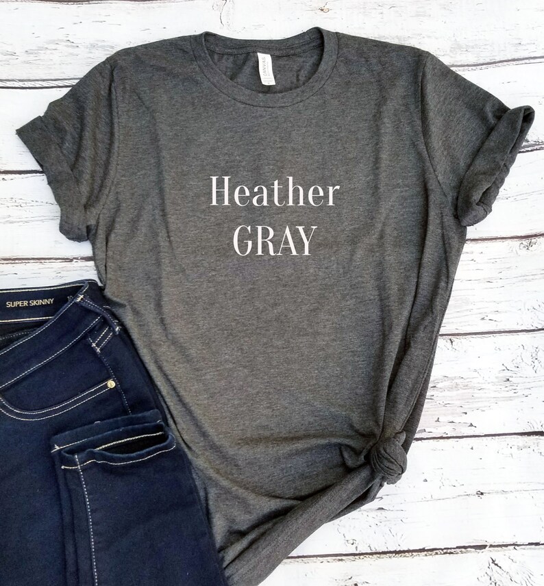 May include: A heather gray t-shirt with the text "Heather GRAY" printed in white on the front.