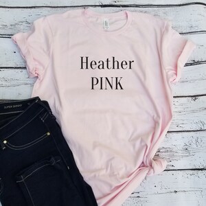 May include: A pink t-shirt with the text "Heather PINK" printed on the front.