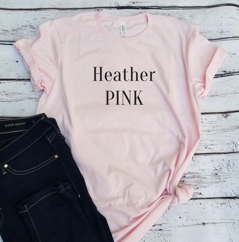 May include: A pink t-shirt with the text "Heather PINK" printed on the front.