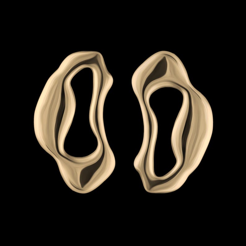 Bold sterling gold statement earrings with fluid organic shape — modern handmade jewelry inspired by ocean forms.