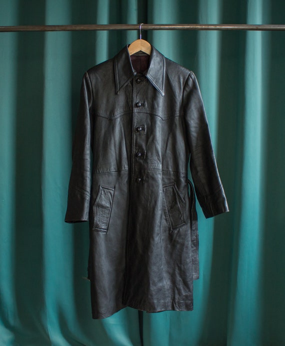 Vintage black leather trench coat with a big 70's