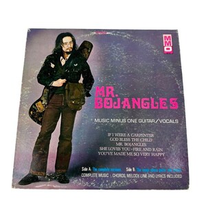 May include: A vintage vinyl record album cover featuring a man with long hair and a guitar. The album is titled "Mr. Bojangles" and includes the song titles "If I Were a Carpenter", "God Bless the Child", "Mr. Bojangles", "She Loves You - Fire and Rain", and "You've Made Me So Very Happy". The album cover is a purple and black color scheme with pink text.