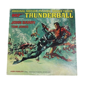 May include: Vintage vinyl record album cover for the James Bond film "Thunderball." The artwork features a diver in a black wetsuit and a man in a red shirt, both armed, amidst a chaotic underwater scene. The album title and artist names are prominently displayed.