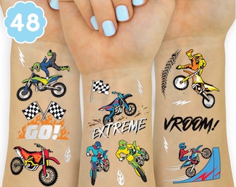May include: A set of 48 temporary tattoos featuring motocross riders, motorcycles, checkered flags, and phrases like "Go!" and "Vroom!" The tattoos are silver and black with orange and blue accents.