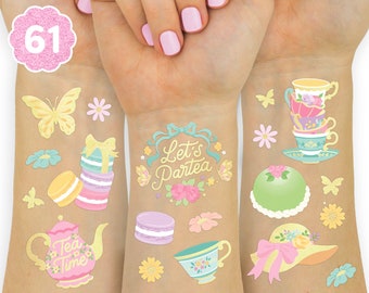 May include: A set of 61 temporary tattoos featuring a tea party theme. The tattoos include images of teacups, macarons, flowers, butterflies, and the text "Let's Partea".